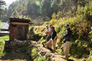 The men waiting for the squatter outhouse in Monjo.