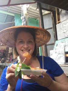 Modeling my new hat and enjoying a fresh spring roll!